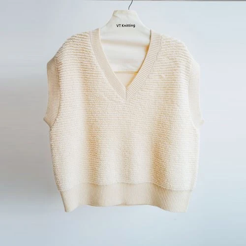Ermeløs kabelstrikket genser med turtleneck